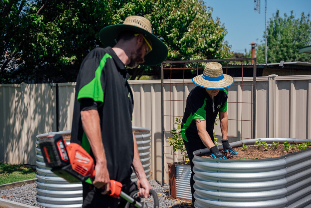 Two Green Clean Team staff members completing an eco-friendly gardening job in Bendigo, Central Victoria.