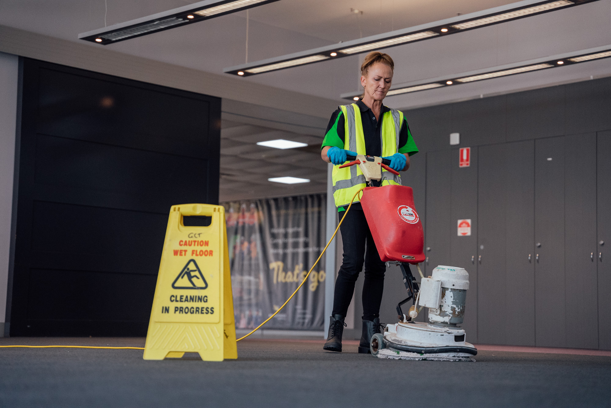 A Green Clean Team staff member opperating a scrubber during an eco-friendly industrial clean in Bendigo, Central Victoria.